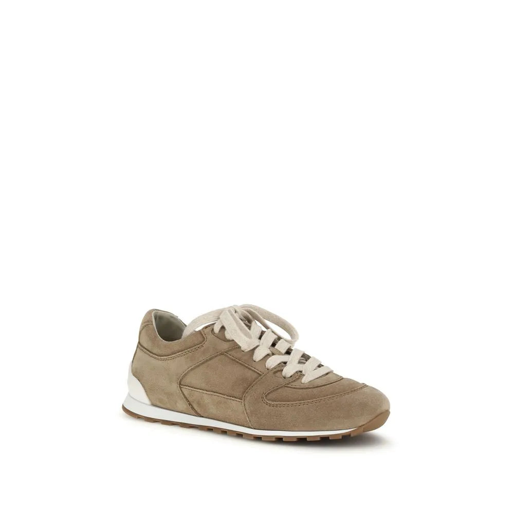 Beige suede low-top sneaker with white laces, rounded toe, and a white and brown rubber sole.