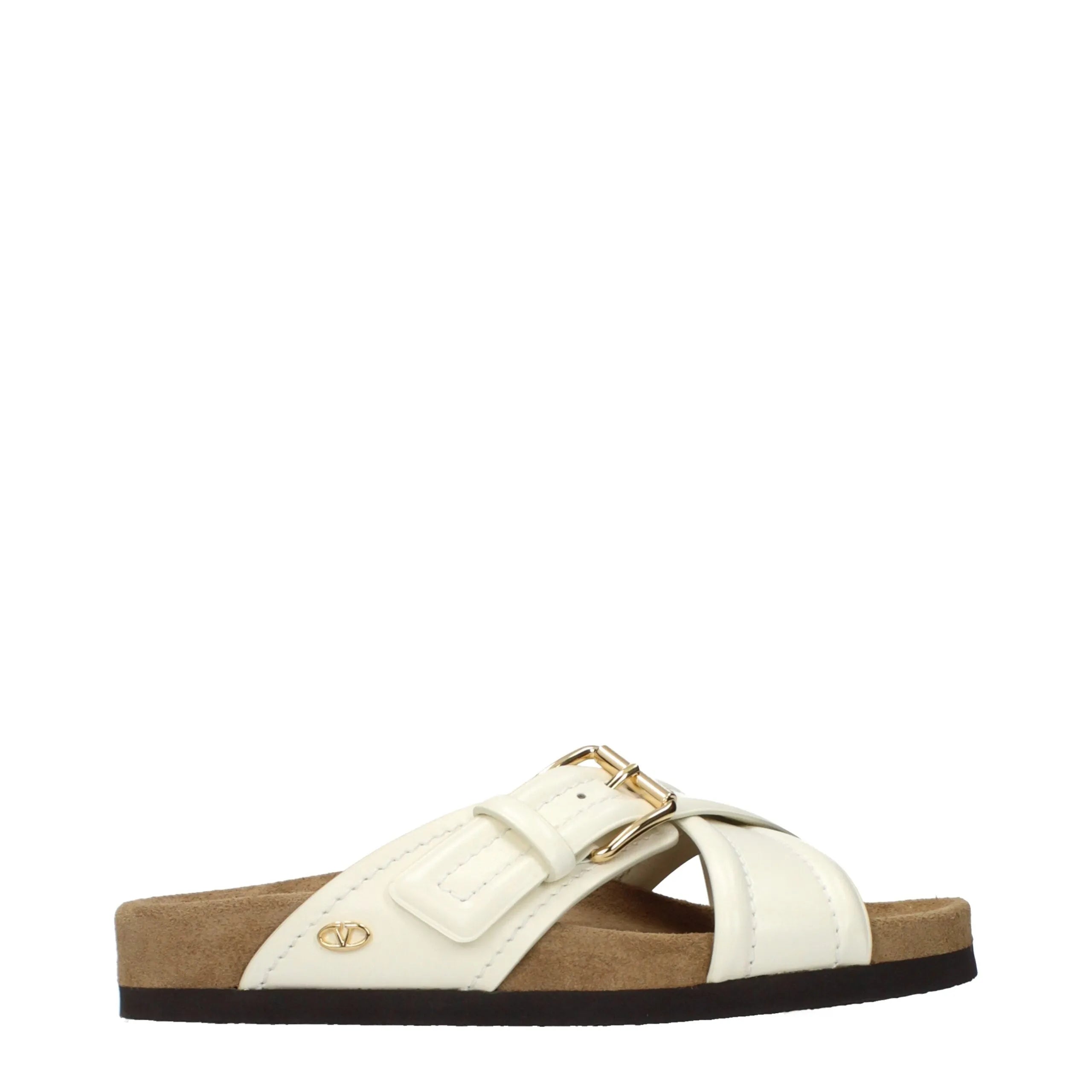 Light beige leather Valentino Garavani slippers with cross straps, gold buckle, and side V logo.