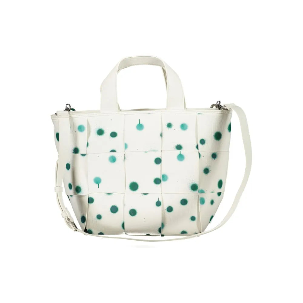 White women's poliuretano handbag with woven texture, teal spray paint dots, top handles, and adjustable strap.
