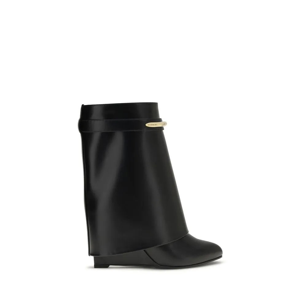 Black calf leather Givenchy Shark ankle boots with pointed toe, covered wedge, and gold GIVENCHY clip.