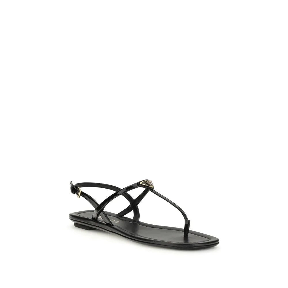 Black patent calf leather flip-flop sandals with metal triangle logo on instep and adjustable ankle strap.