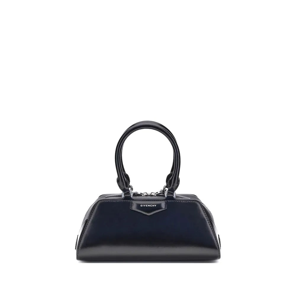 Black calf leather Givenchy Antigona East-West Mini handbag with structured design, top handles, silver hardware, and front logo patch.