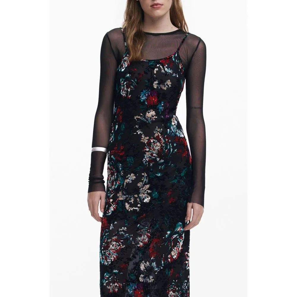 Black polyester women's slip dress with red, green, white floral print, layered over a sheer long-sleeve top.