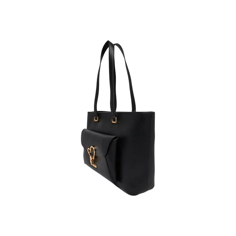 Large black polyurethane Love Moschino shopper bag with gold heart, front flap pocket, and wide handles.