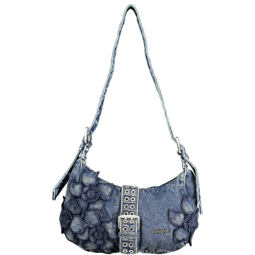 Distinctive Desigual blue denim women's shoulder bag with floral appliques and prominent buckle.