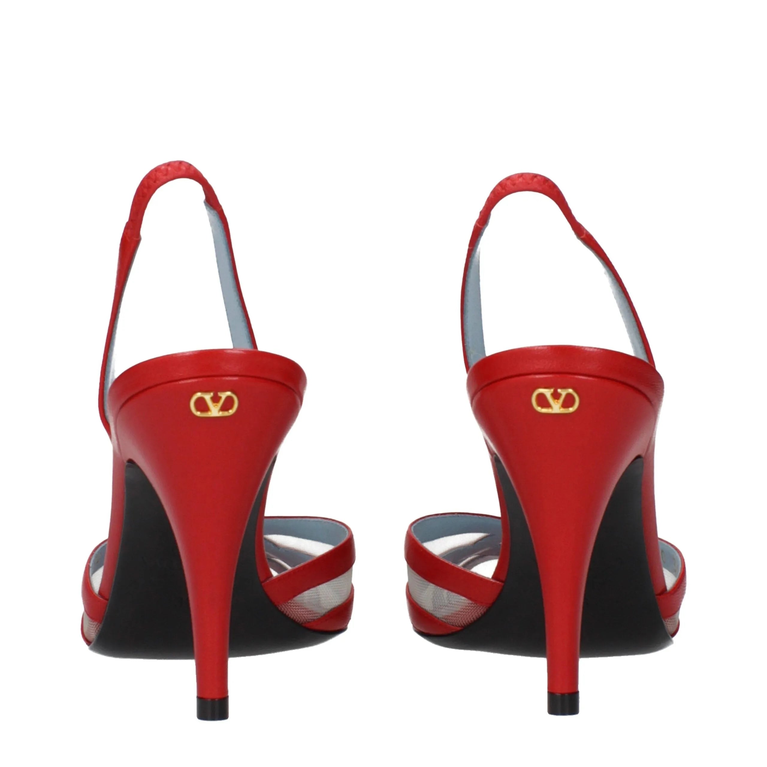 Red leather stiletto heel sandals by Valentino Garavani with gold back logo and sheer side straps.