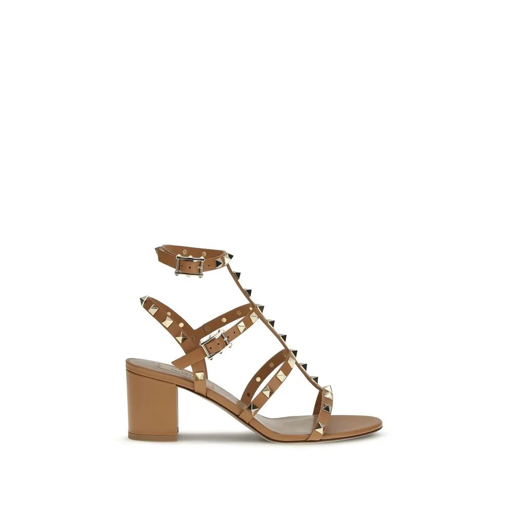 Tan calf leather strappy sandals with gold Rockstuds, adjustable ankle buckle, and a comfortable block heel.