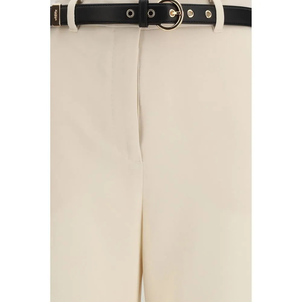 Luminous ivory triacetate dress pants with high waist, black nappa leather belt, and gold circular buckle.
