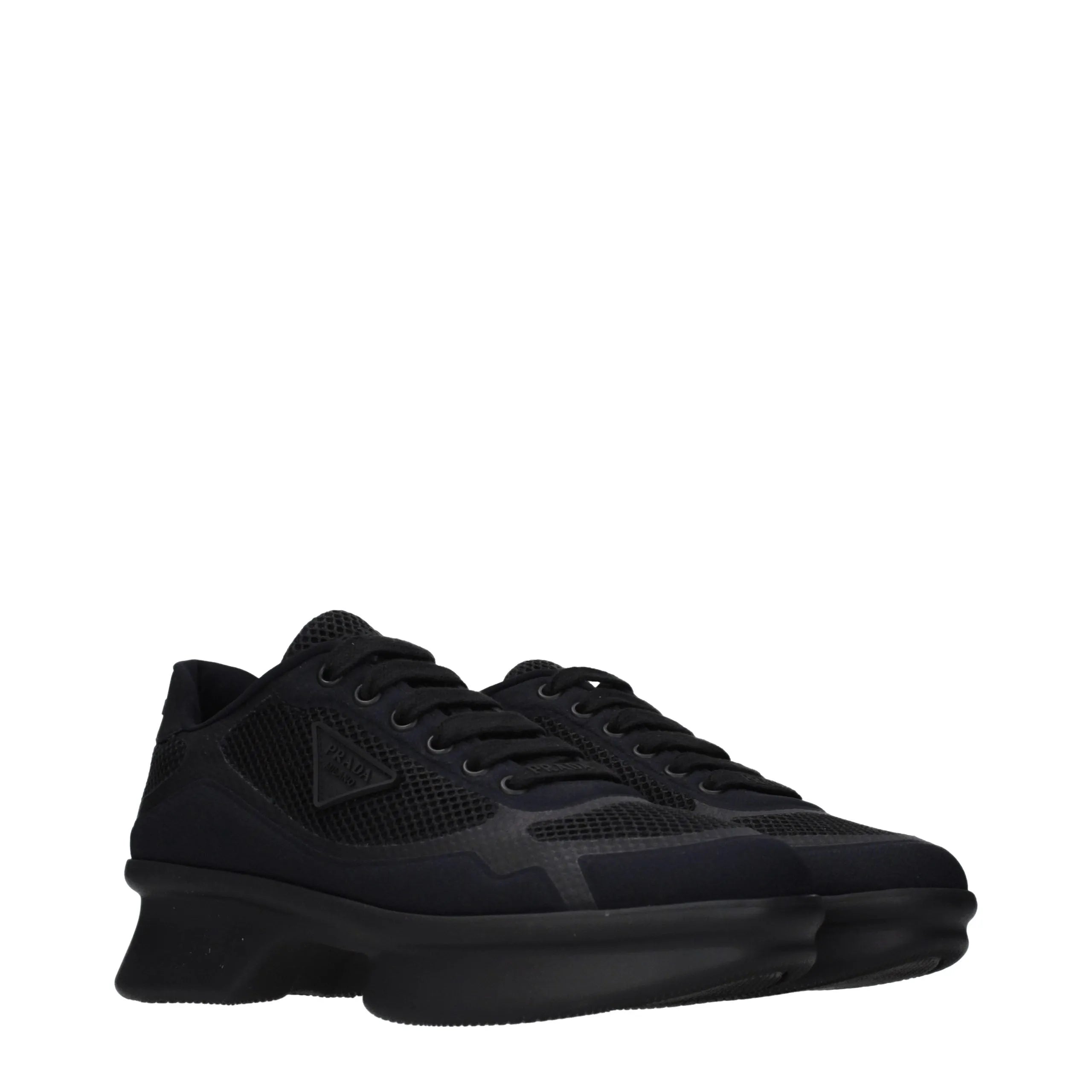 Black Prada fabric low top sneakers with mesh upper, thick sole, and iconic side triangle logo.