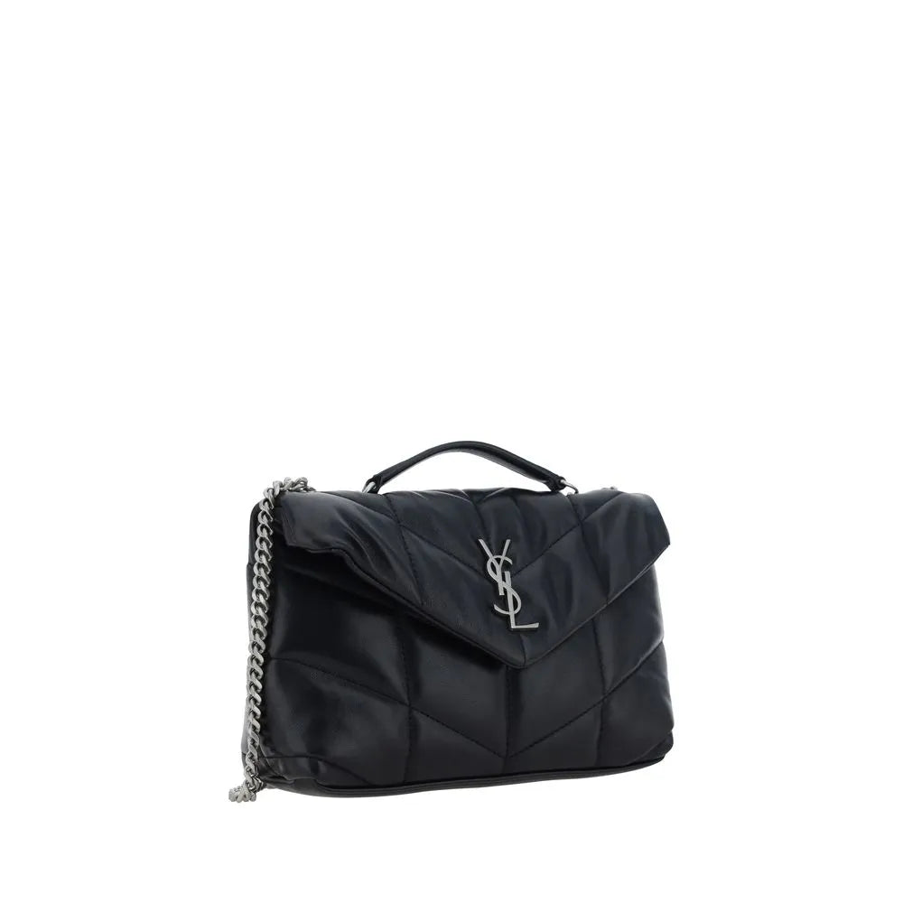 Black lambskin mini shoulder bag with padded chévron quilting, silver YSL logo, rigid top handle, and sliding chain strap.
