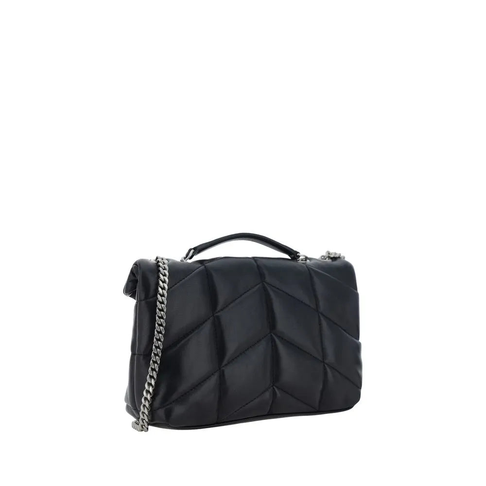 Black lambskin mini shoulder bag with padded chévron quilting, rigid top handle, and silver chain strap.
