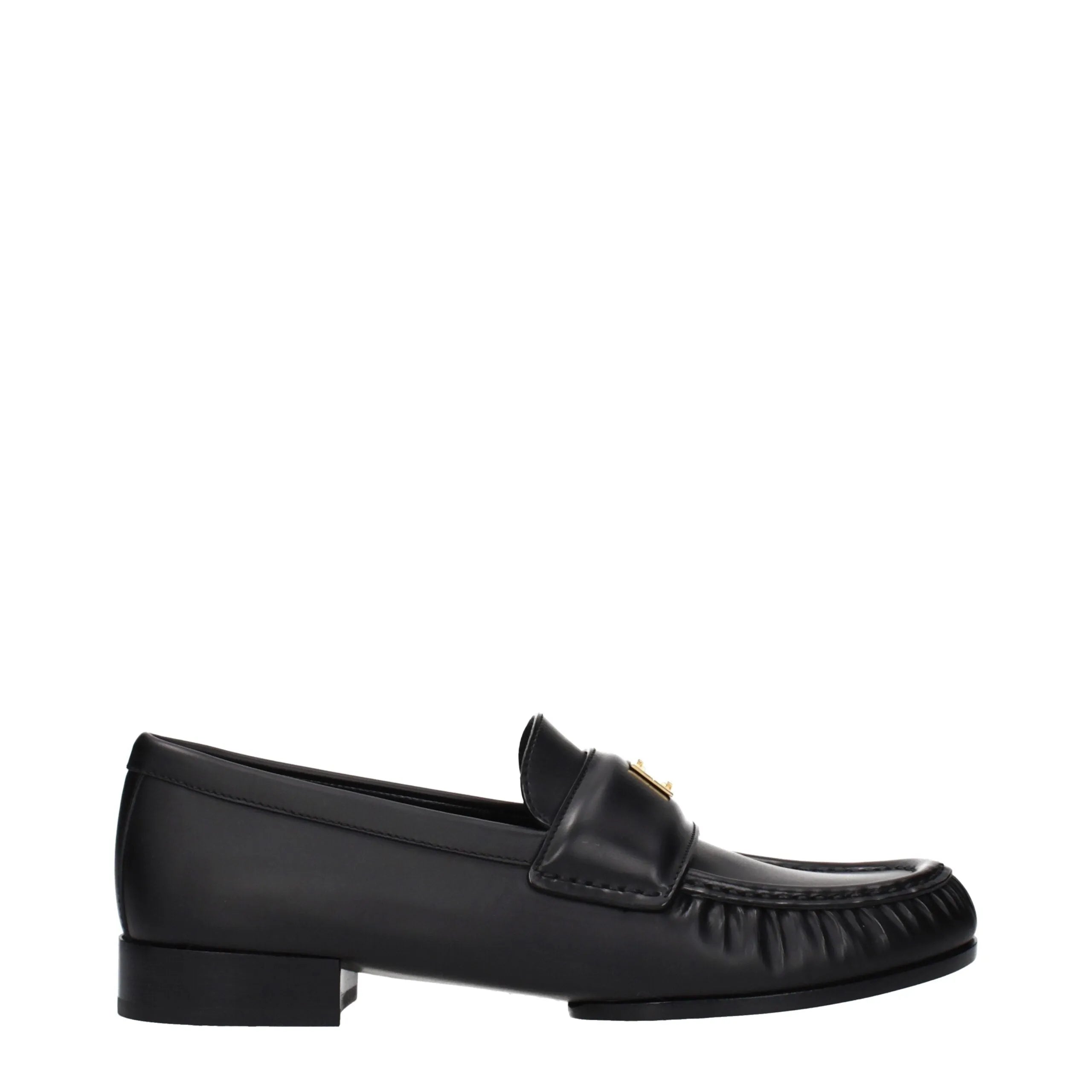 Black leather Givenchy slip-on loafers with gold front logo and ruched toe.