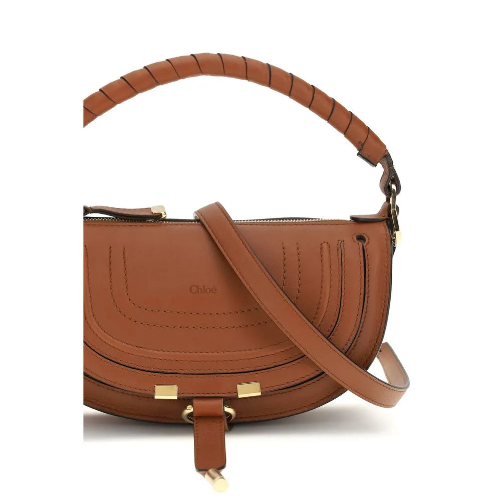 Brown Chloé Marcie mini calf leather shoulder bag with saddle stitching, wrapped top handle, gold hardware, and front logo.