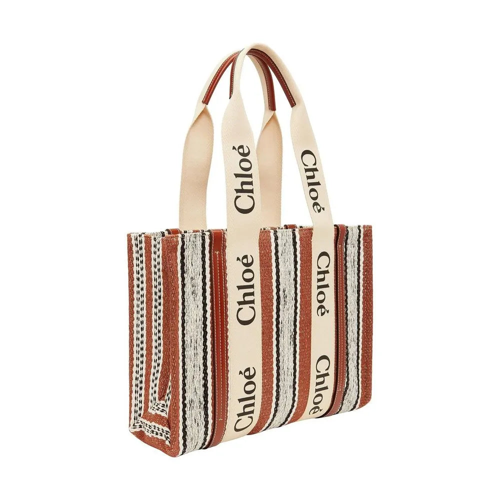 Brown striped linen tote bag with Chloé logo ribbon handles and leather accents.
