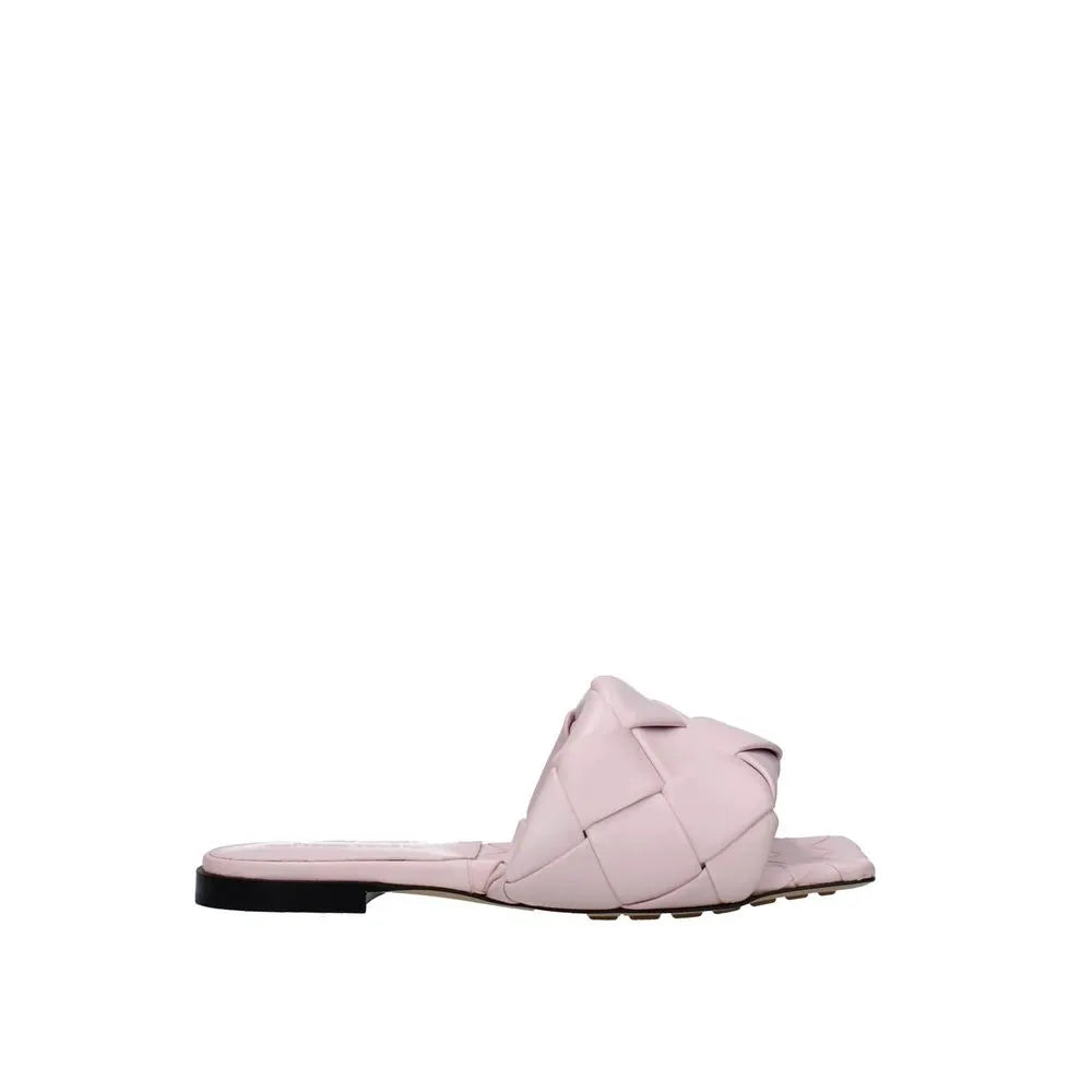 Pale pink women's calfskin flat sandals with a wide woven strap and square toe. Made in Italy.